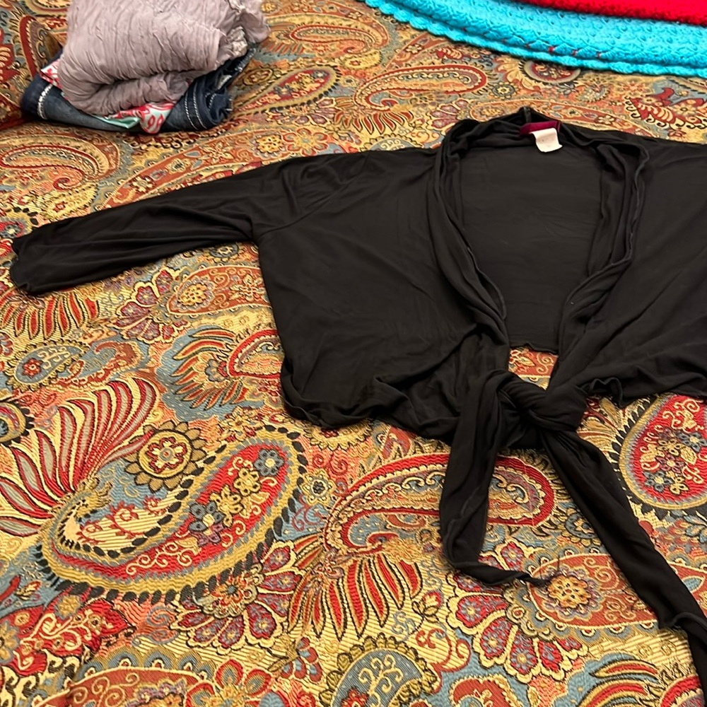 Black shirt cape that ties at the bottom front